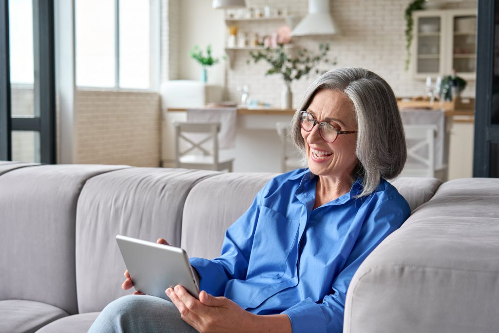 Grandparent using technology to connect with grandchild
